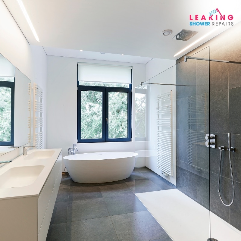 Expert tiling services for modern bathrooms: Sleek tilework, frameless shower, and freestanding tub.