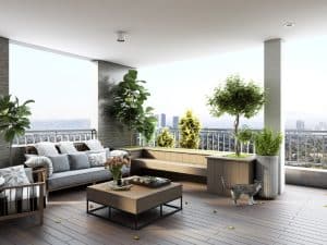 Modern balcony design with outdoor seating, potted plants, and city view for a relaxing ambience.