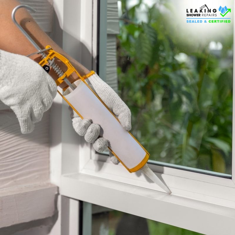 Professional Shower Sealing & Caulking around a window frame for watertight protection and long-lasting durability.