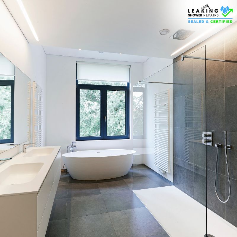Expert tiling services for modern bathrooms: Sleek tilework, frameless shower, and freestanding tub.