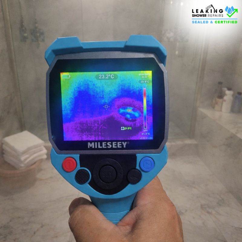 Handheld thermal camera identifying hidden moisture during water leak detection