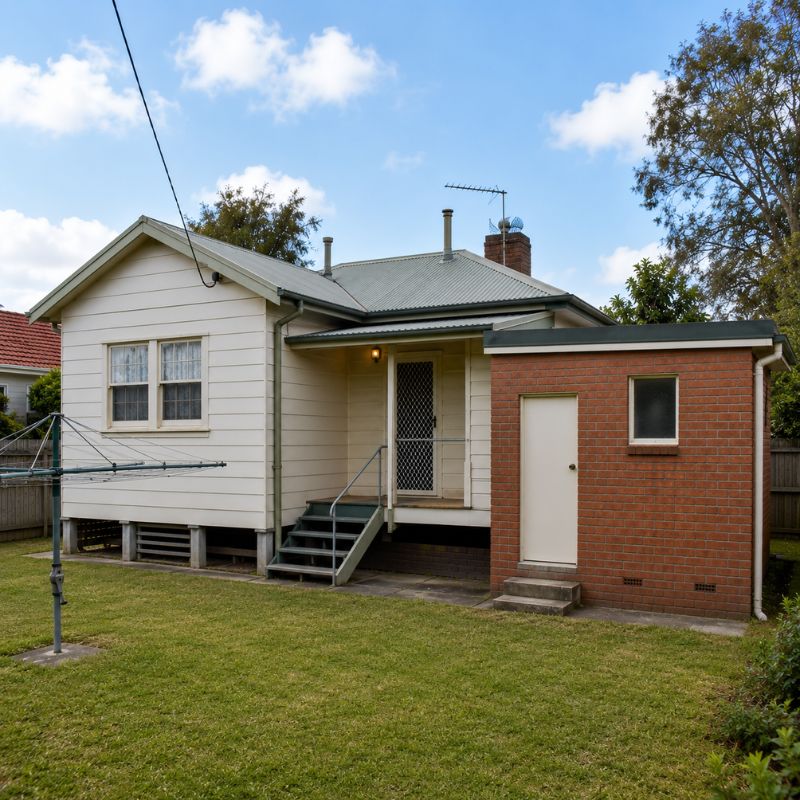 Post-war fibro cottage with a later brick bathroom addition built onto the rear of the house.